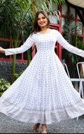 white rayon anarkali kurti in round neck, long sleeves, tassals and latkans