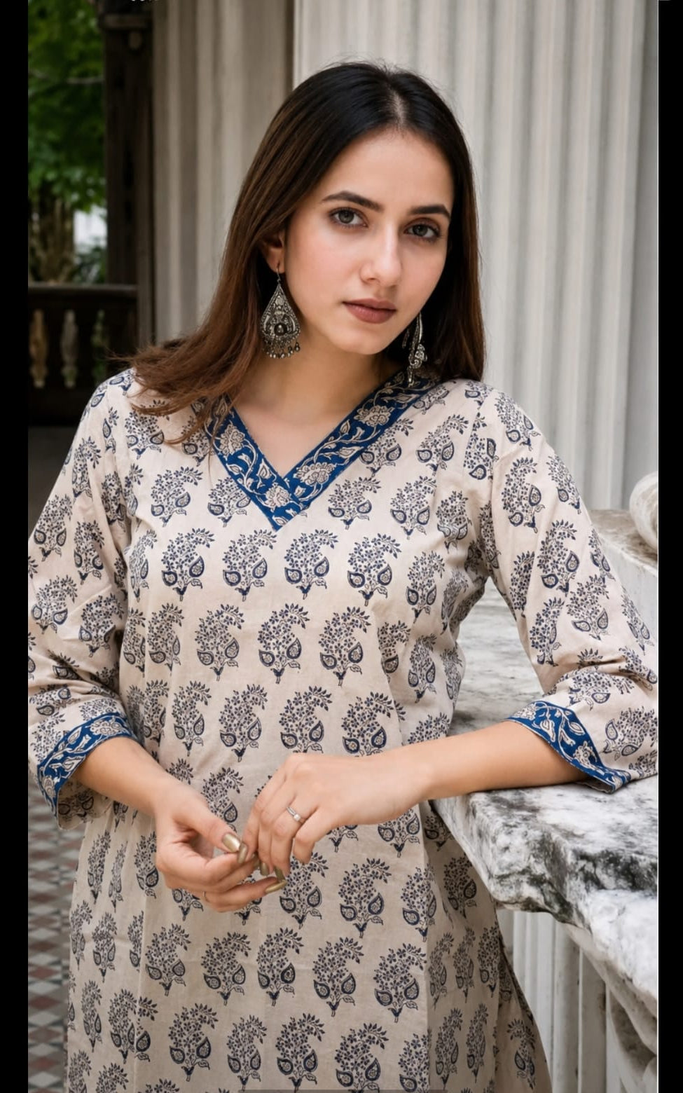 cotton short kurti in V-neck, calf length, sleeve length is three quater