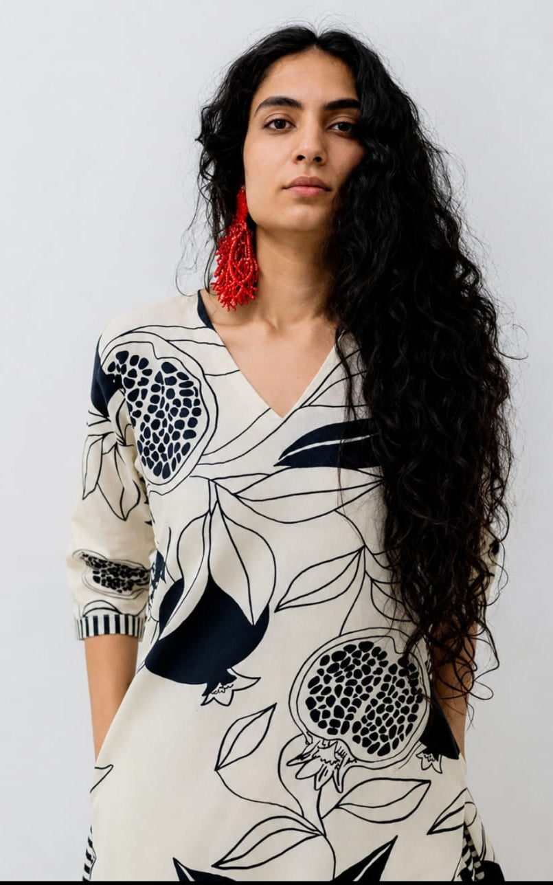 V-neck white cotton kurti, calf length, sleeves length is three quater
