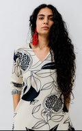 V-neck white cotton kurti, calf length, sleeves length is three quater