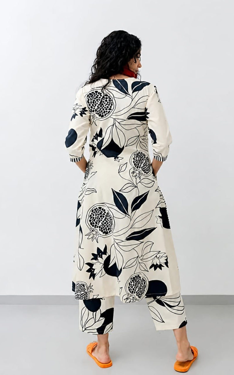 V-neck white cotton kurti, calf length, sleeves length is three quater