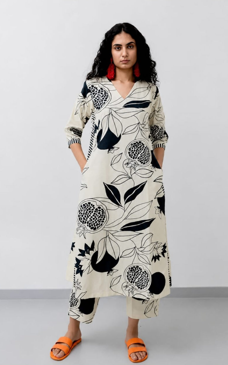 V-neck white cotton kurti, calf length, sleeves length is three quater