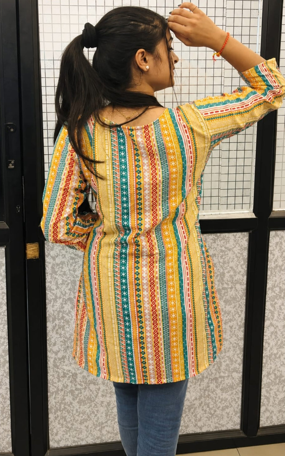 V-neck stitched kurti, above knee, sleeves length is three quater