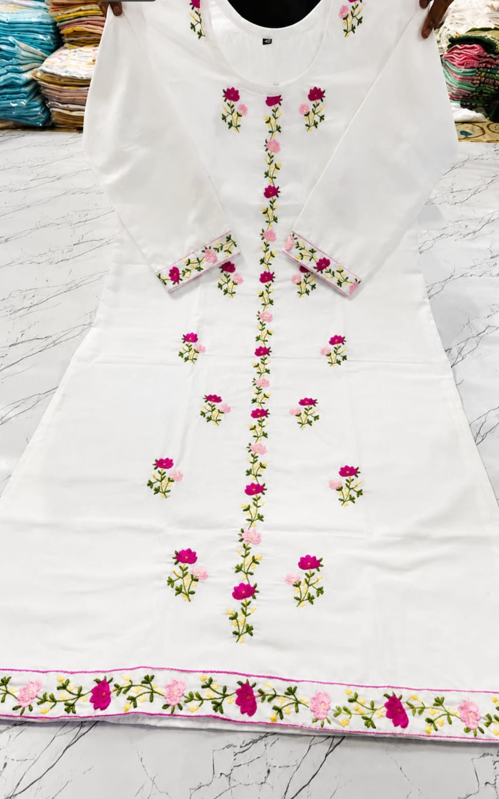 Cotton kurti in round neck, calf length, sleeves length is three quater